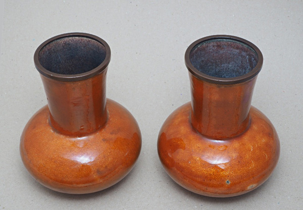 Bushey Museum Orange enamel vases by Sir Hubert von Herkomer